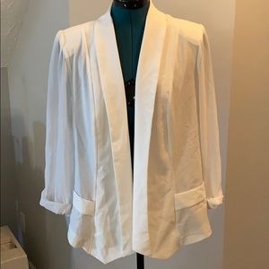 White blazer with chiffon sleeves.